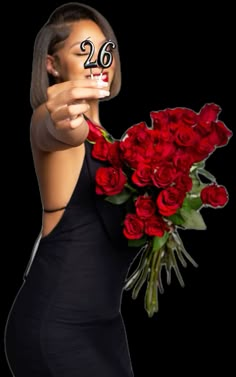 a woman holding a bouquet of red roses with the number twenty six drawn on her face