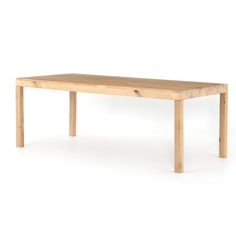 a wooden table sitting on top of a white floor