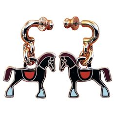 Cute and Beautiful Authentic Hermès Earrings In shape of horses Made of lacquered metal / rose gold plated finish (pinky gold) For pierced ears Colorway: "FAUBOURG" (pinky gold, coral orange saddle, burgundy mane and tail, white hooves) "HERMÈS", hallmarks and serial number engaved at back of each earring "HERMÈS PARIS -H- Made in France" engraved on each clasp Measurements: - Total height: 3,1 cm - Each horse is 2,2 cm at longest / 2 cm at highest Condition: New Condition. Never used. Would make a great gift ! Will come in their original Hermès box with dustbag and booklet These earrings are garanteed authentic and will be shipped immediately Thank you for watching my items ! Prince Rainier, Mane N Tail, Hermes Box, Hermes Paris, Coral Orange, Rose Earrings, Rose Gold Earrings, Pierced Ears, Rose Gold Plates