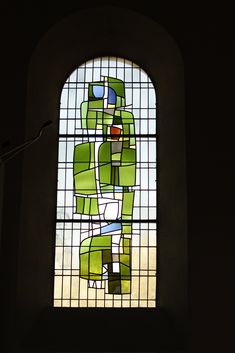 a stained glass window in a dark room