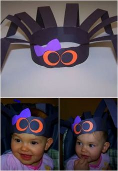 a baby wearing a spider costume made out of construction paper