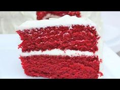 a piece of red velvet cake with white frosting