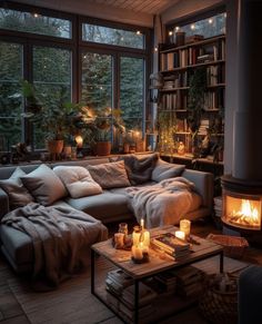 a living room filled with furniture and a fire place in front of a large window