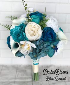 a bridal bouquet with blue and white flowers