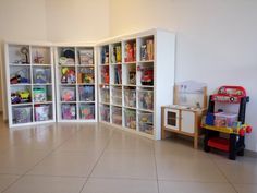 a play room with lots of toys in it