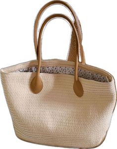 Casual Cream Tote Beach Bag, Trendy Beige Woven Beach Bag, Casual Beige Straw Tote Bag, Trendy Woven Beige Beach Bag, Casual Beige Woven Bucket Bag, Casual Cream Beach Bag For Spring, Casual Neutral Straw Bag For Vacation, Casual Beige Straw Bag For Spring, Casual Cream Straw Bag For Everyday Use