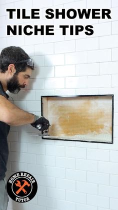 a man in black shirt and gloves holding up a frame with brown substance on it