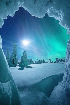 the aurora bore is seen through an ice cave