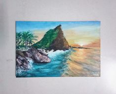 a painting on the wall of a beach with palm trees and an island in the water