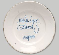 a white plate with blue writing on it