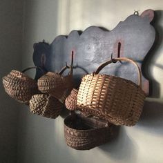 there are baskets hanging on the wall