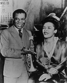 an old black and white photo of a man and woman holding a bottle of liquor