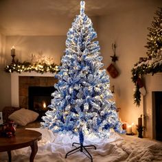 a blue christmas tree with white lights in a living room