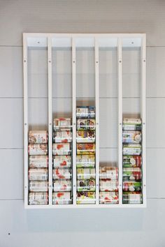 the shelves are filled with canned food items