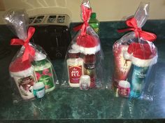 three bags filled with personal care items sitting on a counter next to a toaster