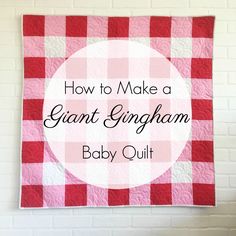 a red and white checkered quilt hanging on a wall with the words how to make a giant gingham baby quilt