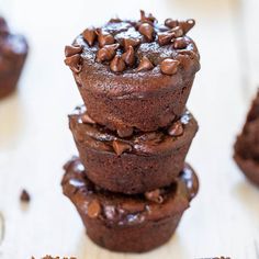 chocolate cupcakes stacked on top of each other with one bite taken out of it