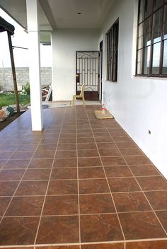 the front porch is clean and ready to be used for cleaning up or remodeling