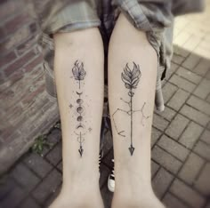 two people with matching tattoos on their legs, one has an arrow and the other has arrows