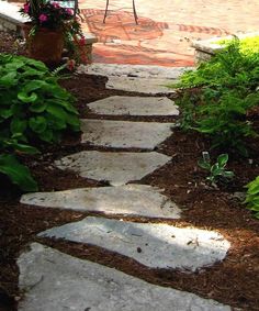 an umbrella is sitting on top of a stone path