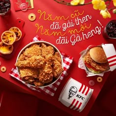 a table topped with fried chicken and other foods