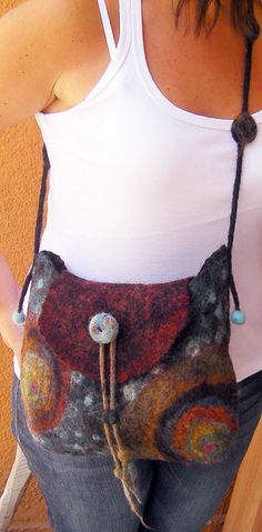 a woman wearing a bag made out of felt