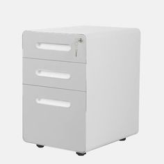 a white filing cabinet with three drawers