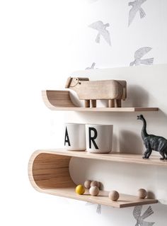 two wooden shelves with toys on them