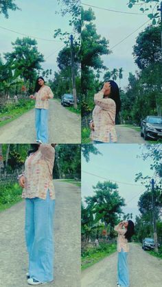 a woman standing on top of a dirt road