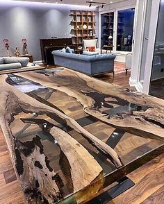 the table is made out of wood and has an abstract design on it's surface