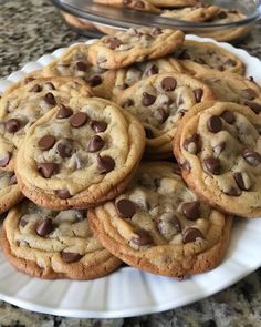 a plate full of chocolate chip cookies on a table