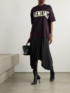 Find BALENCIAGA Pleated Printed Cotton-jersey And Crepe Midi Dress on Editorialist. Balenciaga's dress is inspired by the humble streetwear tee. The top half is cut from cotton-jersey and printed with the logo in tape-like font. It's joined with an asymmetric crepe midi skirt, defined by sharp pleats. Balenciaga Dress, Balenciaga Clothing, Black Balenciaga, Crepe Midi Dress, Balenciaga Women, Cotton Midi Skirt, Latest Skirts, Black Midi Skirt, Pleated Midi Skirt