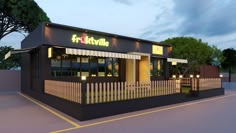 the front of a fast food restaurant with awnings and trees in the background