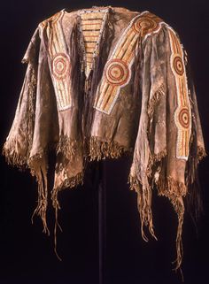 an old jacket with fringes and designs on it