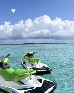 two jet skis are parked in the water