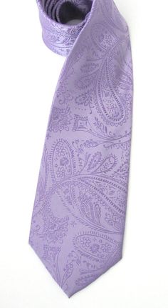 a close up of a purple tie on a white background with an intricate paisley pattern