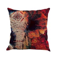 an elephant's head is painted on a pillow cover in red, orange and blue