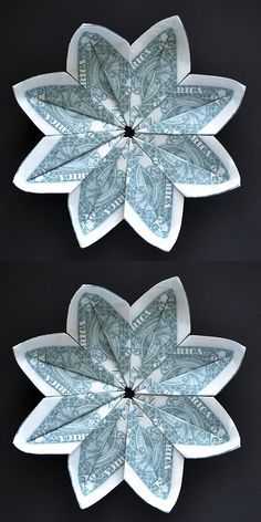 two paper flowers made out of dollar bills