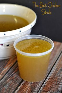 there is a bowl of soup and a cup of tea on the table with it