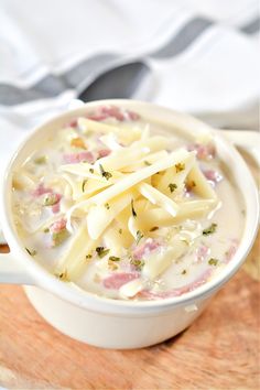 a white bowl filled with pasta and cheese