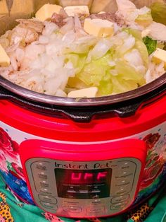 an image of food in the crock pot on the stove top with it's lid open