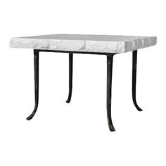 a white table with black metal legs and a marble top on an isolated white background