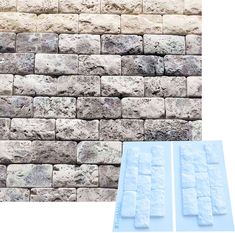 a stone wall with several different sized blocks on it and one is white in color