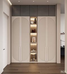 an open closet in the middle of a room with wooden flooring and white walls