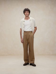 This relaxed pant is expertly cut with a wide leg and puddle hem in a beautiful linen-blend fabric we sourced from Italy, one we selected for its subtle texture and exceptional drape.  Relaxed fit: Mid rise.  Wide leg with extra length for a break at the hem Fabric from Italy's Lanificio Comatex.  Zip-fly with button closure.  Belt loops.  Front and back pockets.  Half lined (lined to the knee).  Wide-leg fit: Mid rise.  Tailored for the at-ease fit of traditional trousers, but with the extra wide-leg and full length of puddle-hem pants.  Wide leg opening measures 20".  Model: Size 32 Regular, 6'2" (188cm). Relaxed Formal Outfit Men, Men’s Wide Leg Trousers Outfit, Wide Leg Trousers Outfit Men, Linen Trousers Outfit Men, Wide Leg Pants Outfit Men, Men Wide Pants, Mens Linen Pants Outfit, Linen Pants Outfit Men, Men Wide Leg Pants