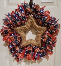 a patriotic wreath hanging on the front door