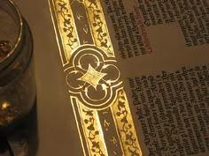 a close up of a book and a glass on a table