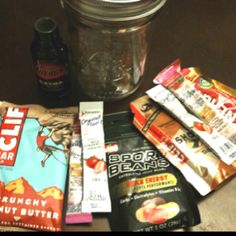 some snacks are sitting on a table next to a jar