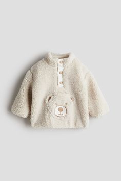 Anorak in soft teddy fleece with an embroidered-motif patch front pocket. Stand-up collar  short placket with snap fasteners  and dropped shoulders. Narrow  concealed elastic at cuffs and hem. Lined. Beige Teddy Bear, Teddy Fleece, Soft Teddy, Cardigan Sweater Jacket, Tight Leggings, Light Beige