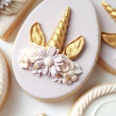 decorated cookies with gold and white decorations